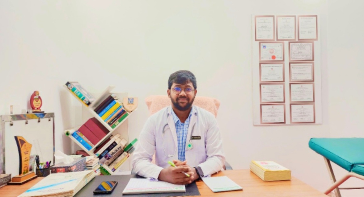 Dr. Ahmed at his consulting desk